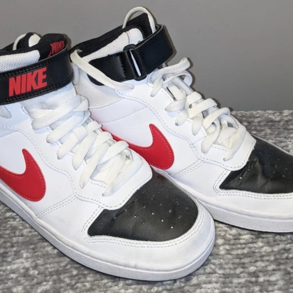White, red, and black Nikes